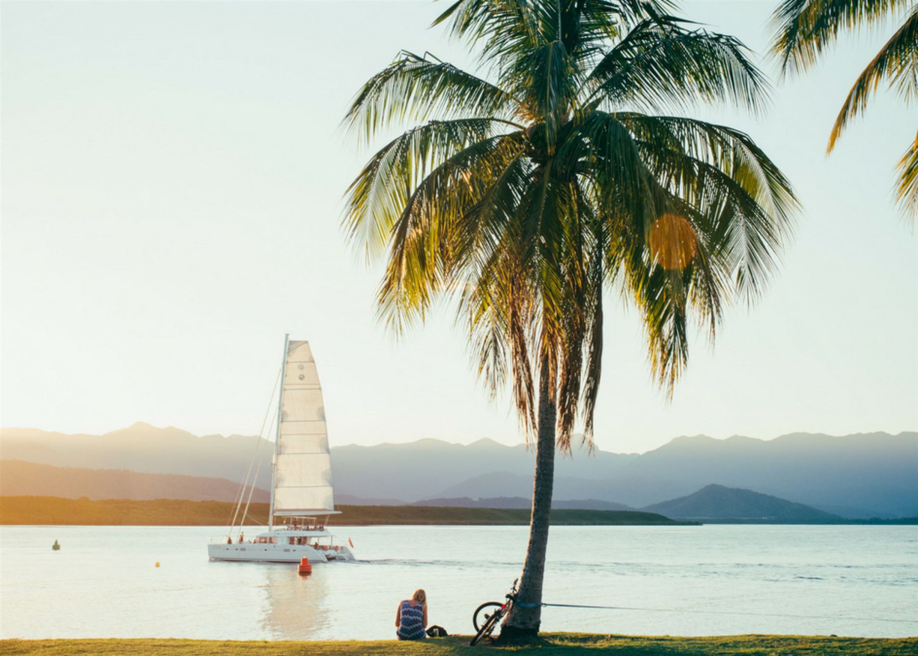 Catamaran sailing at sunset in Port Douglas